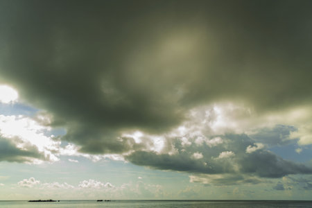 Beautiful view of the blue water of the Atlantic Ocean merging with light blue sky and thunder...