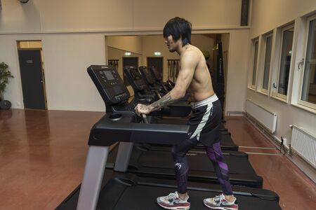 Close up view of young male training in gym. Sport and healthy lifestyle concept. Enkoping. Sweden 07/11/2019のeditorial素材