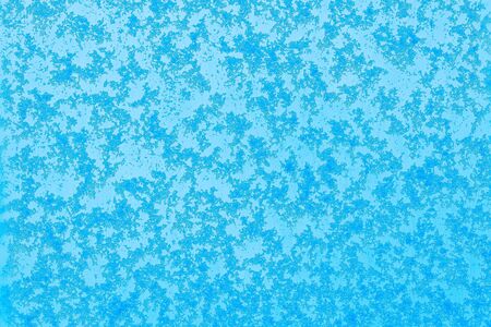 Beautiful close up view of natural snow pattern on blue background. Beautiful backgrounds texture.の写真素材