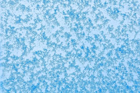 Beautiful close up view of natural snow pattern on blue background. Beautiful backgrounds texture.の写真素材