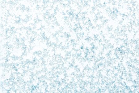Beautiful close up view of natural snow pattern on light blue background. Beautiful backgrounds texture.の写真素材
