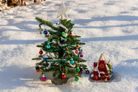 Close up view of a decorative Christmas tree with small toys. Christmas Holiday Concept. Postcard. Beautiful backgrounds.の写真素材
