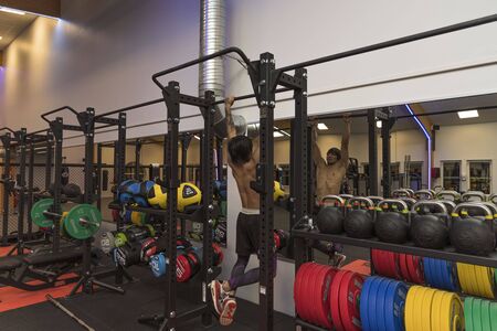 Close up view of a male doing pull-ups. Healthy lifestyle concept. Enkoping. Sweden 07/11/2019のeditorial素材