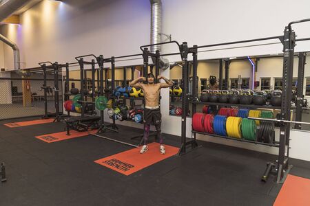 Close up view of young male training in gym. Sport and healthy lifestyle concept. Enkoping. Sweden 07/11/2019のeditorial素材
