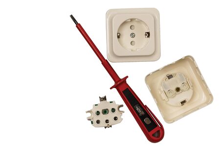Close up macro view of white power socket with red tester. Electricity concept.の写真素材