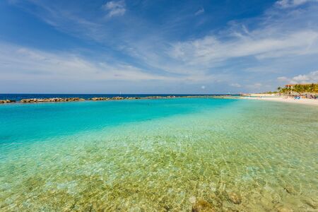 Amazing view of turquoise water of Atlantic ocean and blue sky with white clouds. Curacao island .. Beautiful nature background.の写真素材