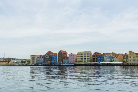 Beautiful view of colorful houses on blue sky background. Travel Tourism Trips concept. Colorful backgrounds texture. Willemstad. Curasao. 20/09/2019.のeditorial素材