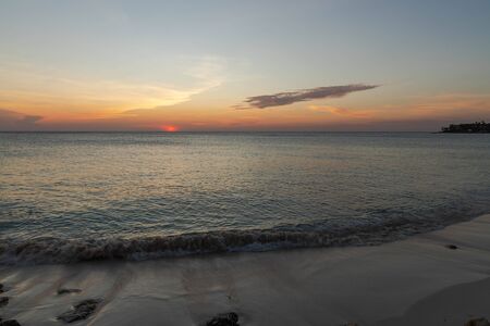 Amazing sunset on Eagle Beach of Aruba Island. Caribbean.Unforgettable view. Beautiful nature landscape.の写真素材