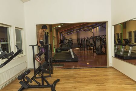 Close up view of young male training in gym. Sport and healthy lifestyle concept. Enkoping. Sweden 07/11/2019のeditorial素材