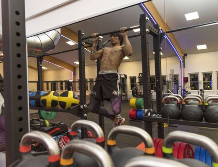 Close up view of a male doing pull-ups. Healthy lifestyle concept. Enkoping. Sweden 07/11/2019のeditorial素材