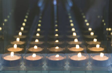 Beautiful view of candlelights with mirror reflection. Holidays romantic concept.の写真素材