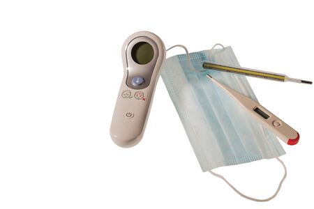 Close up view of face mask and different kind of thermometers isolated on white background. Health concept.の写真素材