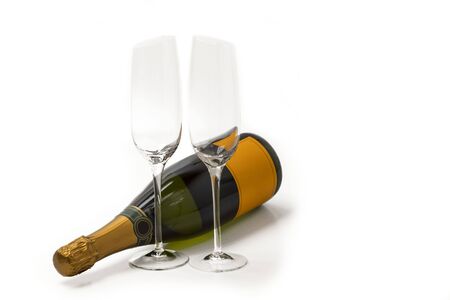 Beautiful view champagne bottle and two slim, tall and elegant champagne glasses on white background. Beautiful backgrounds. Alcohol concept. Uppsala. Swedenの写真素材