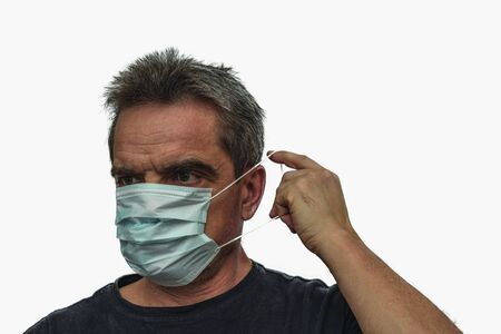 Close up view of man in white face mask. Influenza virus concept.の写真素材
