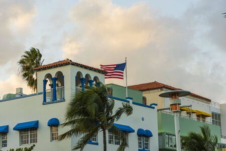Beautiful colorful buildings and palm trees on blue sky background. Architecture concept.の写真素材