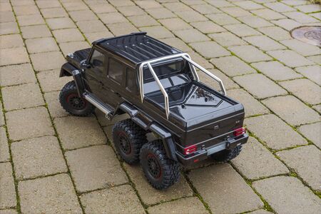 View of radio controlled model racing car on off-road background. Toys with remote control. Free time. Children and adults conceptの写真素材