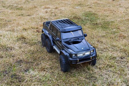 View of radio controlled model racing car on off-road background. Toys with remote control. Free time. Children and adults conceptの写真素材