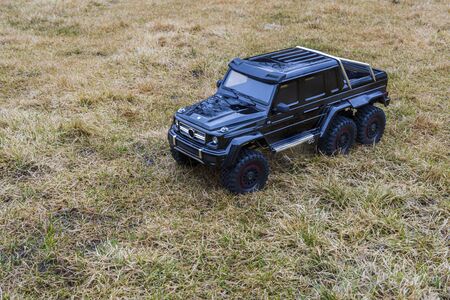View of radio controlled model racing car on off-road background. Toys with remote control. Free time. Children and adults conceptの写真素材