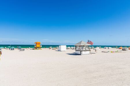 Beautiful landscape view of Miami South Beach coast line. Sand beach, Atlantic Ocean, people on blue sky background. USA Miami Beach. 24/09/2019.のeditorial素材