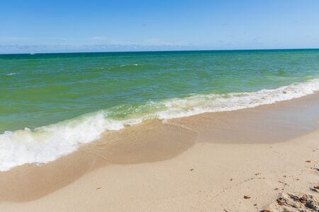 Amazing view of turquoise water of Atlantic ocean and blue sky with white clouds. Miami Beach. Beautiful nature background.の写真素材