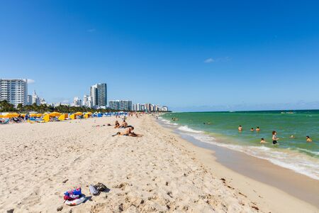 Beautiful landscape view of Miami South Beach coast line. Sand beach, Atlantic Ocean, people on blue sky background. USA Miami Beach. 24/09/2019.のeditorial素材