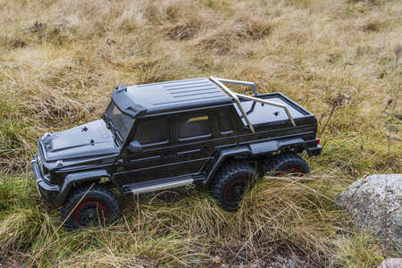 View of radio controlled model racing car on off-road background. Toys with remote control. Free time. Children and adults concept. Sweden, Uoppsala. 02.16.2020.のeditorial素材