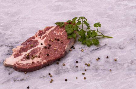 Close up view of raw pork steak with spices isolated. Food concept.の写真素材