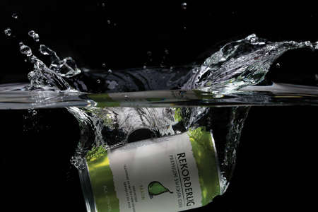 Close up view of can falling in water. Pear sider. Sweden Uppsala. 14/03/2020.のeditorial素材