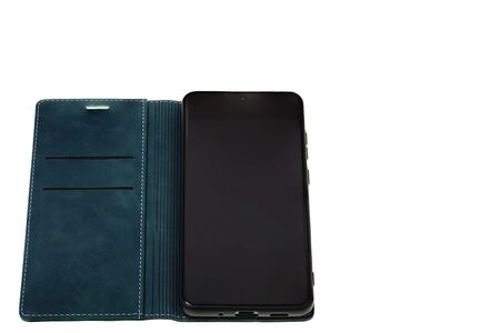 Close up view of mobile phone in green case isolated on white background. Communication concept.の写真素材