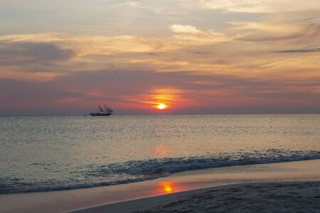 Amazing sunset on Eagle Beach of Aruba Island. Caribbean.Unforgettable view. Beautiful nature landscape.の写真素材