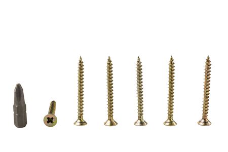 Close up view of screws and cross magnetic bit isolated. Industrial equipment concept.の写真素材