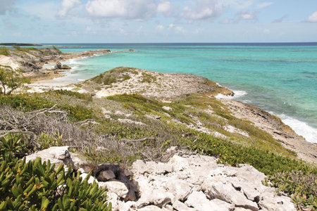 Amazing view of turquoise water of Atlantic ocean and blue sky with white clouds. Bahamas islands....