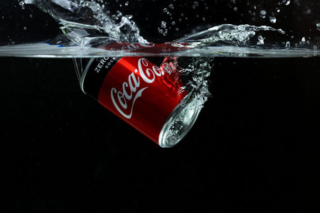 Close up view of can falling in water. Coca cola. Sweden Uppsala. 14/03/2020.のeditorial素材