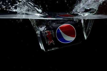 Close up view of can falling in water. Pepsi Cola. Sweden Uppsala. 14/03/2020.のeditorial素材