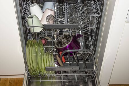 Close up view of open dishwasher. Technology background,の写真素材