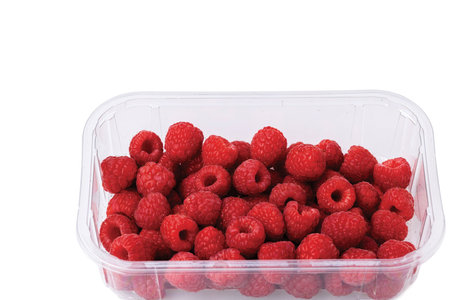 Close up view of fresh colorful raspberry isolated on white background. Beautiful background.