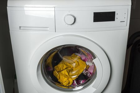?lose-up view of washing clothes in a washing machine. Home routine concept.の写真素材