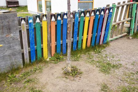 Beautiful view of colorful children garden fence in form of multicolored pencils. Exterior concept.の写真素材