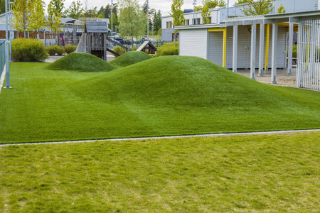 Close up view of playground of children garden covered with artificial grass. Europe.Sweden.