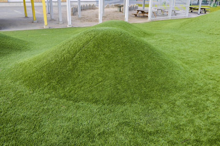 Close up view of playground of children garden covered with artificial grass. Europe Sweden