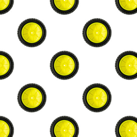 Close up view pattern of mini size yellow plast wheel with black tire isolated on white background....