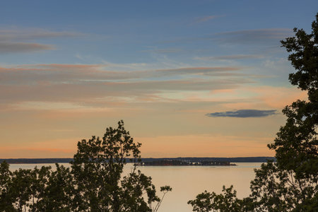Amazing beauty sunset on Baltic sea on blue sky with pink clouds. Beautiful summer nature...