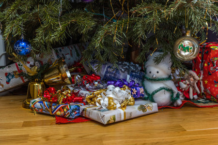 Close up view of presents under decorated christmas tree. Christmas holidays concept. Postcard....