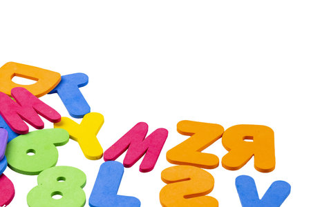 Close up view of colorful letters on white background. Learning concept.