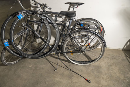 Close up view of two parked bicycles and one of them with flat tire. Healthy life style concept....