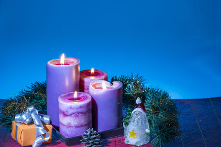 Close up view of Christmas burning candles and decoration objects. Postcard. Christmas and New Year...