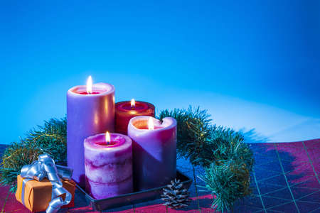 View of Christmas burning candles and decoration objects. Postcard. Christmas and New Year holidays concept background.の写真素材