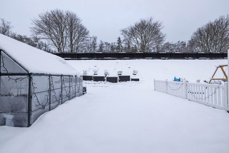 Gorgeous winter view of exterior of a private small garden Landscape design. Beautiful winter nature...