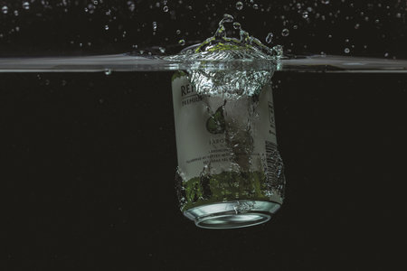 Close up view of can falling in water. Pear sider. Sweden. Uppsala. 03.21.2021のeditorial素材