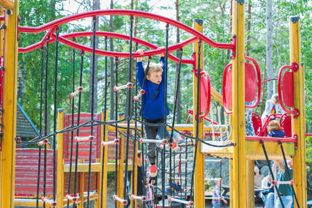 Parents with children are relaxing in a children's amusement park on a summer day. Europe. Kolmorden, Sweden. 09.28.2020.のeditorial素材